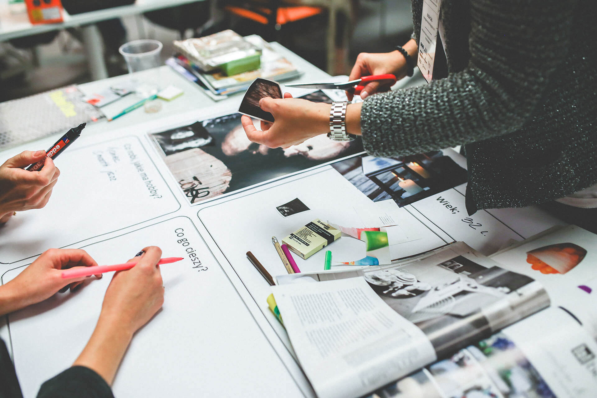 A team arranging prints for a campaign