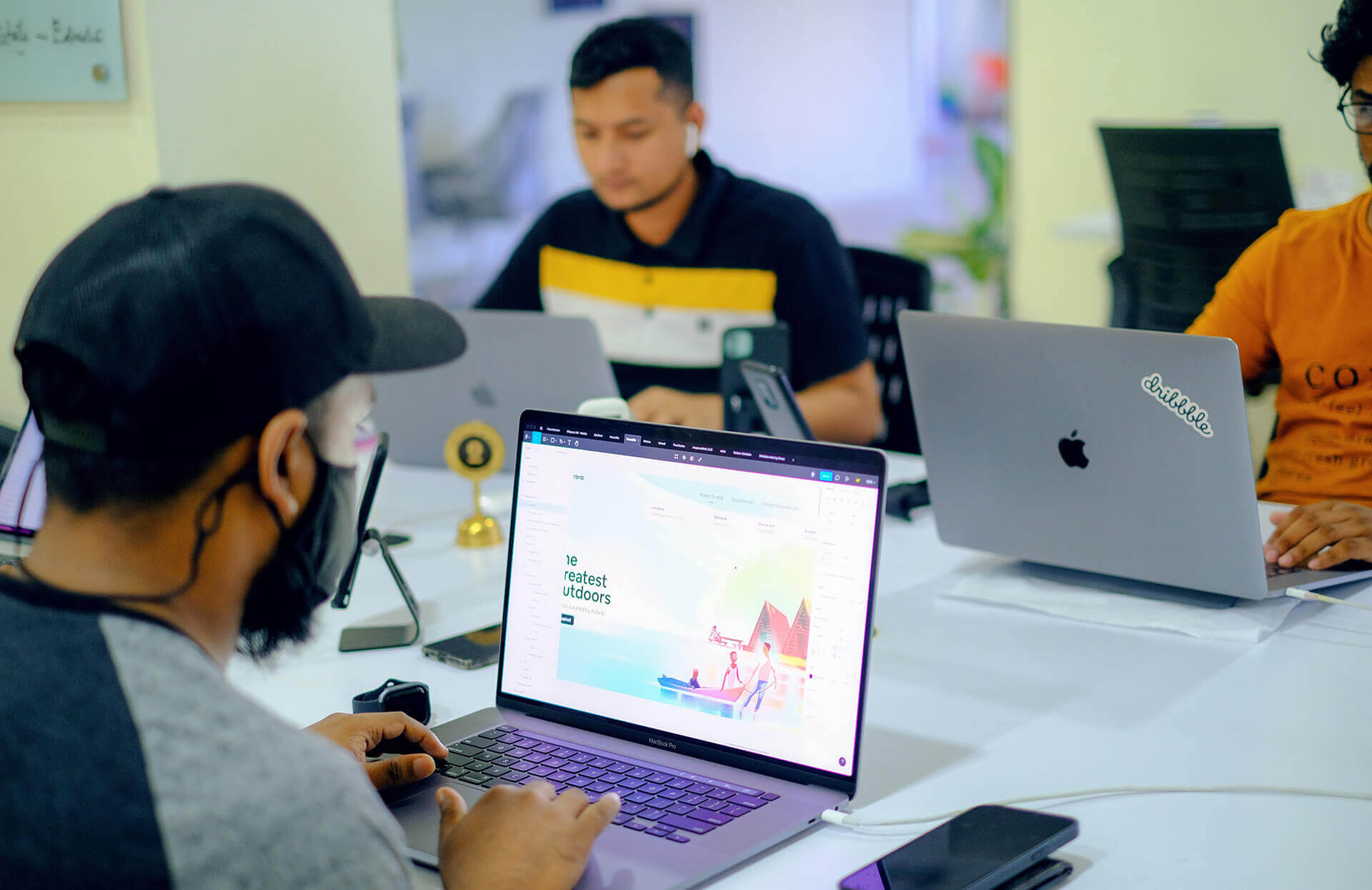 A development team working at laptops